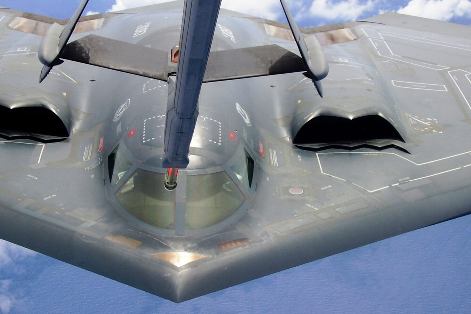 A close up of the wing and underside of an aircraft.